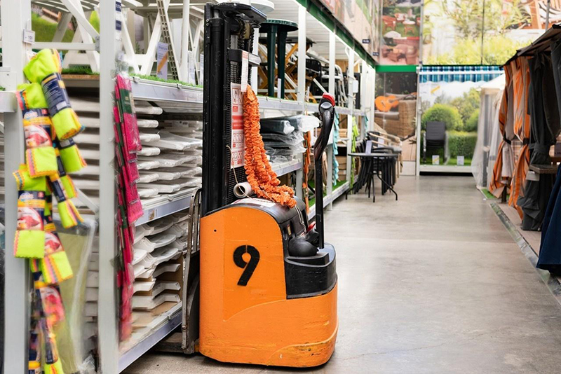 Pallet truck. Used for unloading goods in supermarkets.