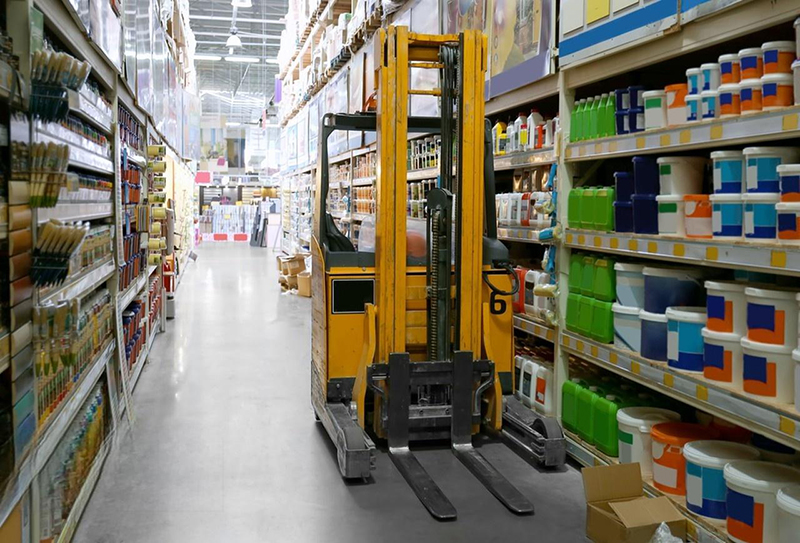 Stacking truck in wholesale warehouse